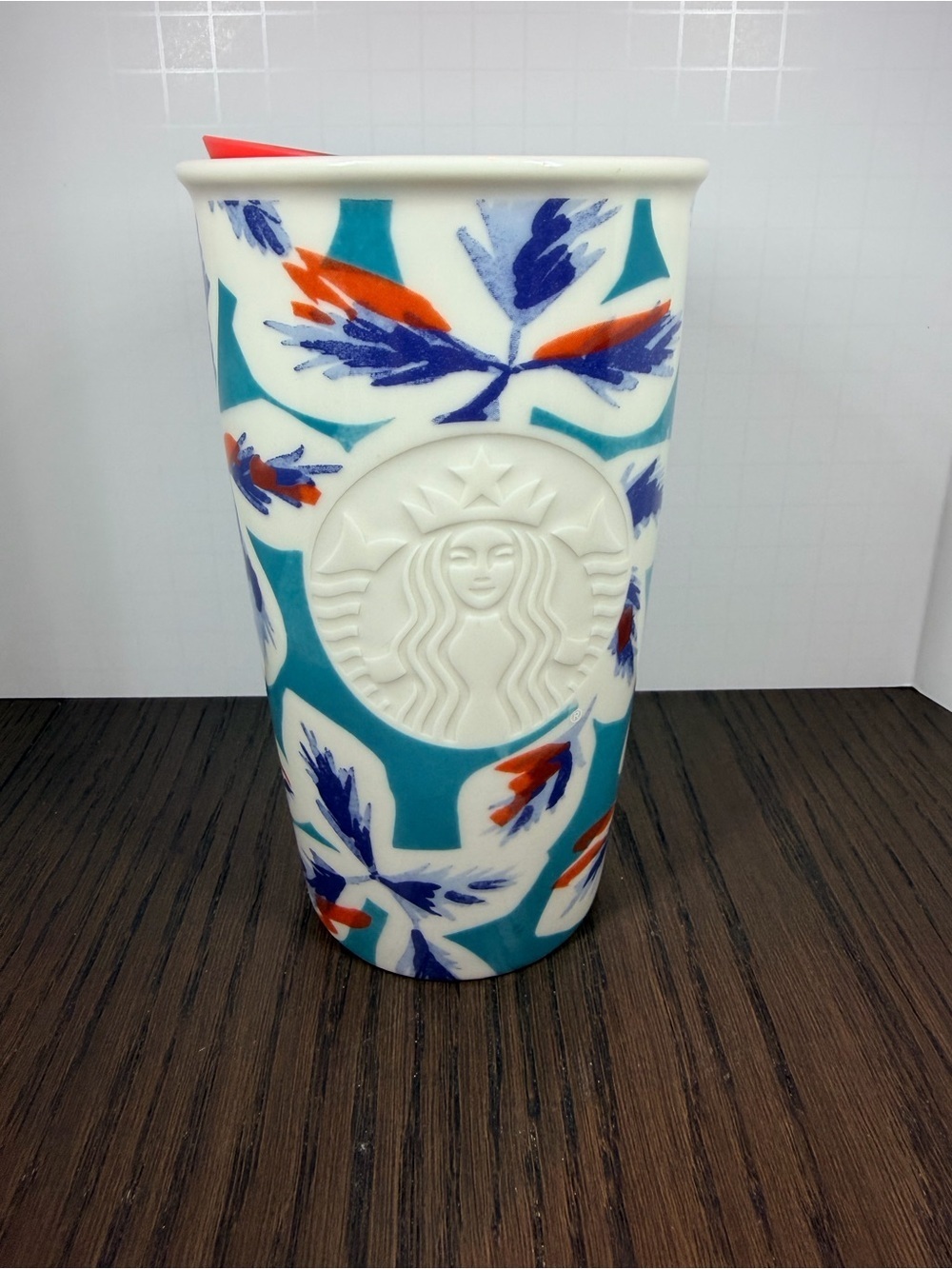 Starbucks Ceramic Tumbler with Lid in Teal, Blue, and Orange Floral Motif